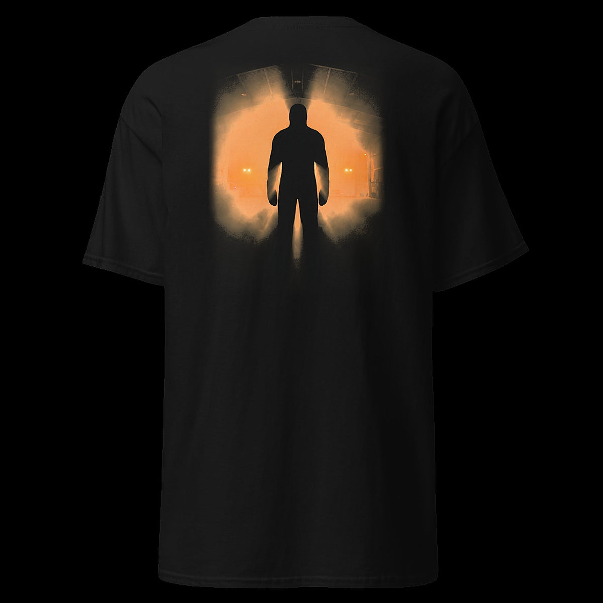 THE HANGAR tee back - colossal silhouette in amber floodlit hangar