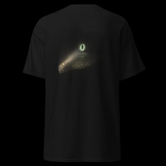 IT RUNS tee back - tall figure at the treeline in flashlight beam